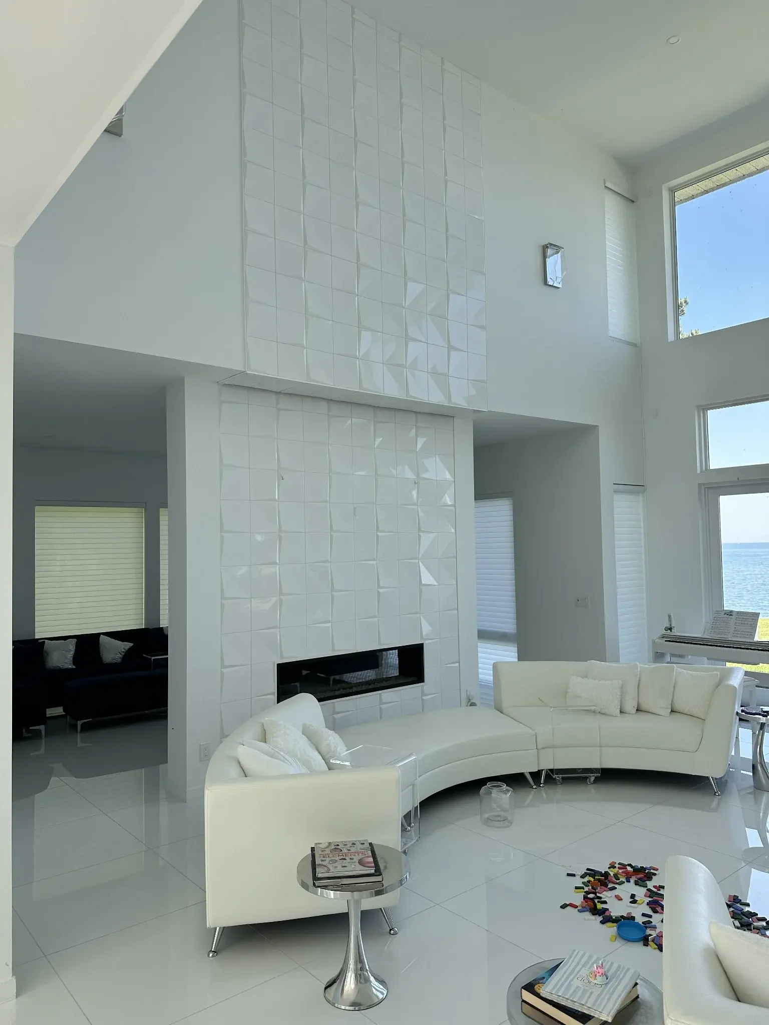 Floor-to-ceiling geometric tile fireplace feature wall installed by ARA Flooring